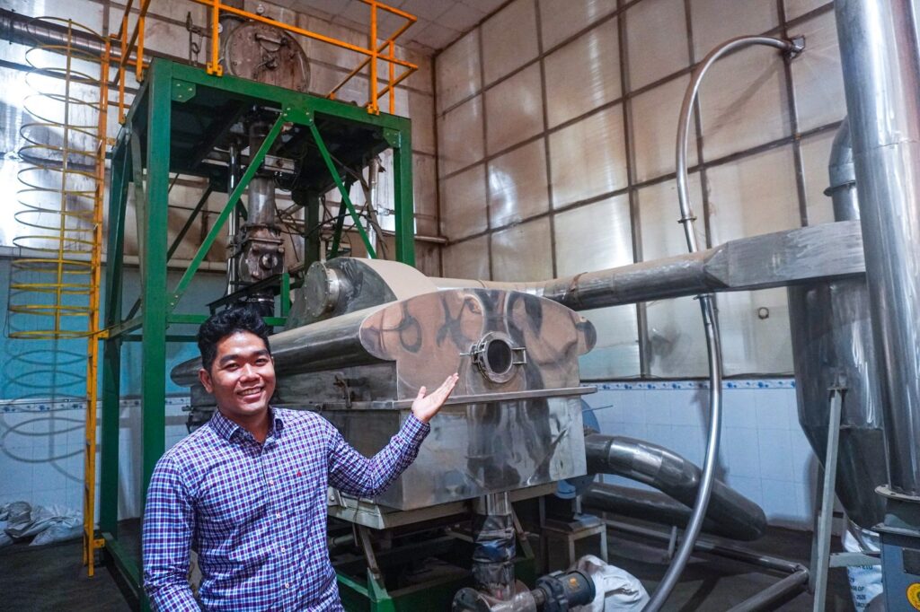 Liam Phan at a pepper processing line